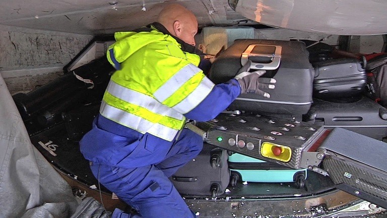 Turntime Technologies ground crew servicing aircraft cargo hold